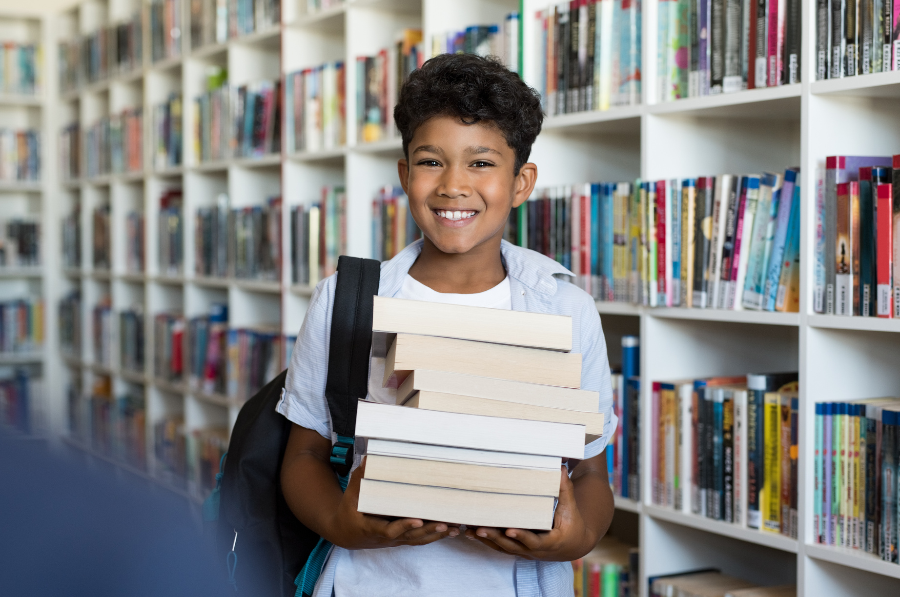 Elementary School Boy Holding Books